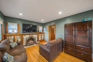 Living room with light hardwood / wood-style flooring