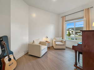 Living area with light hardwood / wood-style floors