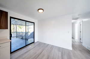 Interior space featuring light hardwood / wood-style floors and a textured ceiling