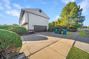 View of side of home with a garage