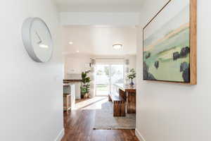 Corridor featuring dark hardwood / wood-style floors