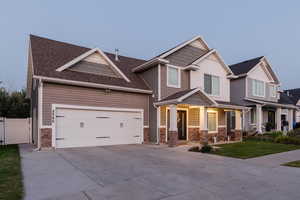 Craftsman-style house with covered porch and a garage