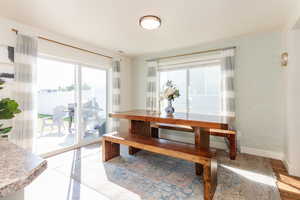 Dining space with wood-type flooring