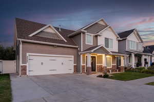 Craftsman house featuring a garage and covered porch