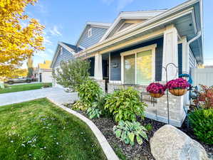 Exterior space with a yard and covered porch