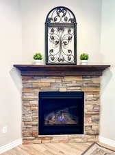 Interior details with stone fireplace and hardwood mantle