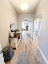 Hall featuring light wood-tile flooring