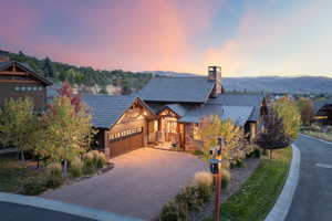 View of front of home featuring a garage and a mountain view