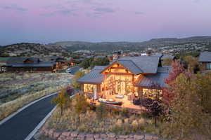 View of back of house with an outdoor hangout area and a mountain view