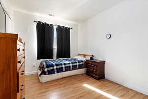 Bedroom with light wood-type flooring