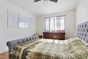 Bedroom featuring light wood-type flooring and ceiling fan