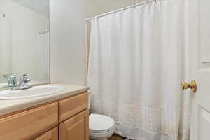 Bathroom with vanity and toilet