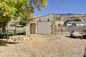 View of outbuilding with a mountain view