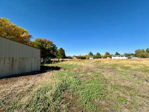 View of yard with a rural view