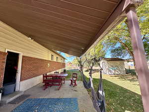 View of patio / terrace with a storage unit