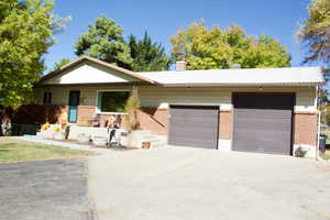 Ranch-style house featuring a garage