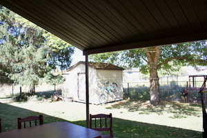 View of yard featuring a shed