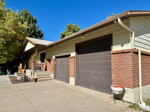 View of side of home with a garage