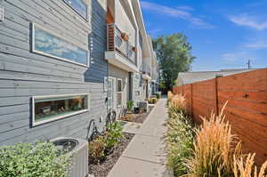 View of side of home with central AC