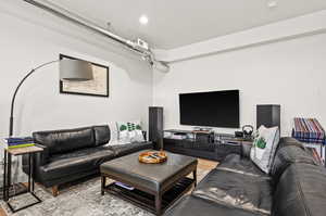 Living room with light hardwood / wood-style flooring