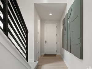 Hallway featuring light wood-type flooring