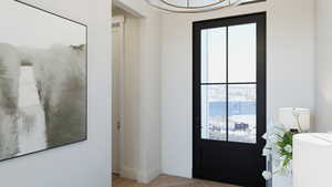 Foyer with light hardwood / wood-style flooring