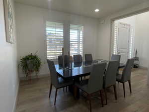 Dining space with light hardwood / wood-style floors