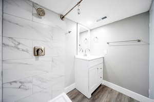 Bathroom with  tiled shower, and vanity