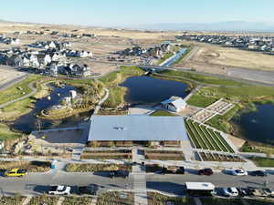 Birds eye view of property with a water and mountain view