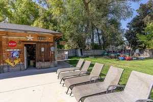 View of patio / terrace with a trampoline and a shed