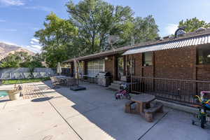 View of patio with a mountain view and grilling area