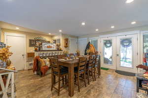 Dining room with french doors and hardwood / wood-style floors