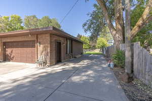 View of property exterior with a garage