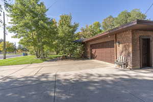 View of property exterior featuring a garage