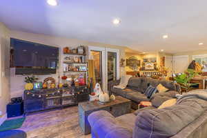 Living room with wood-type flooring