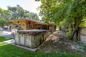 Exterior space featuring a patio area and a hot tub