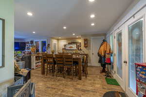 Dining room with hardwood / wood-style flooring