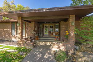 Entrance to property featuring a porch