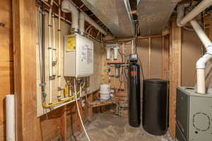 Utilities featuring tankless water heater