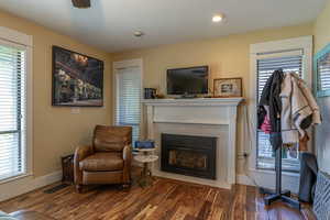 Living area featuring a fireplace and dark hardwood / wood-style flooring