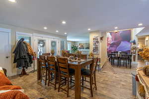 Dining room featuring hardwood / wood-style flooring and french doors