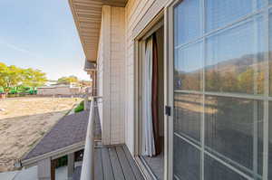 Entrance to property with a balcony