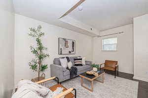 Living room with wood-type flooring