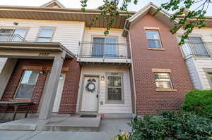 View of front of home with a balcony