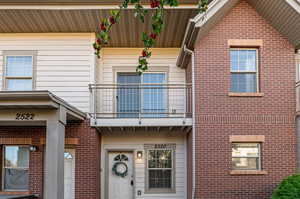 Doorway to property featuring a balcony