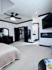 Bedroom with light carpet, crown molding, and ceiling fan