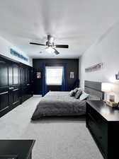 Bedroom featuring ceiling fan and light carpet