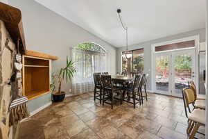 Dining area with lofted ceiling