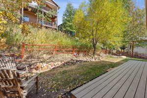 View of yard with a balcony