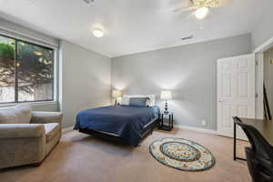 Bedroom featuring carpet floors and ceiling fan